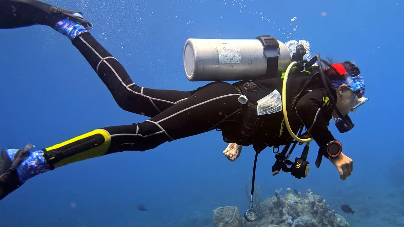Scuba diver in perfect trim hovering over the reef in the Saba Marine Park