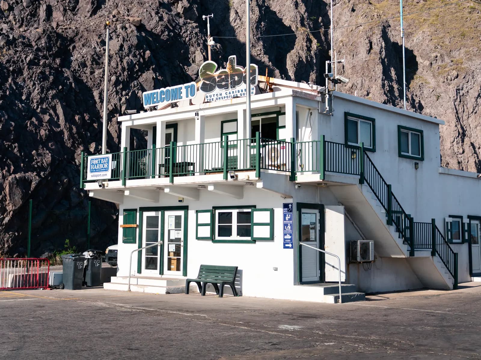 The Fort Bay Harbor Office beneath Saba's cliffs, where visiting yachts clear in