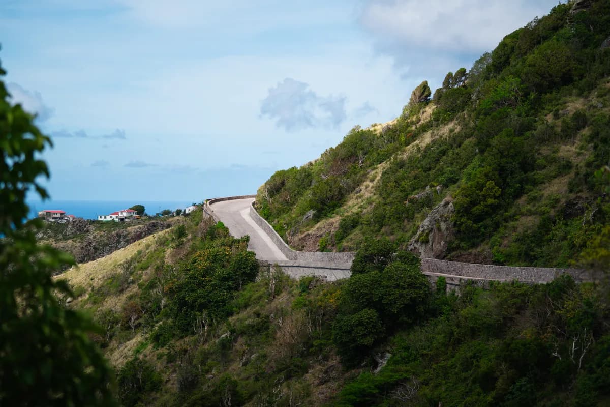 The winding road through Saba's lush green hills and traditional cottages